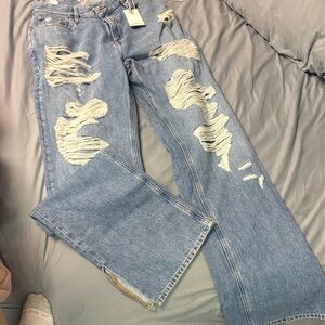 Good American High Rise Ripped Blue Jeans